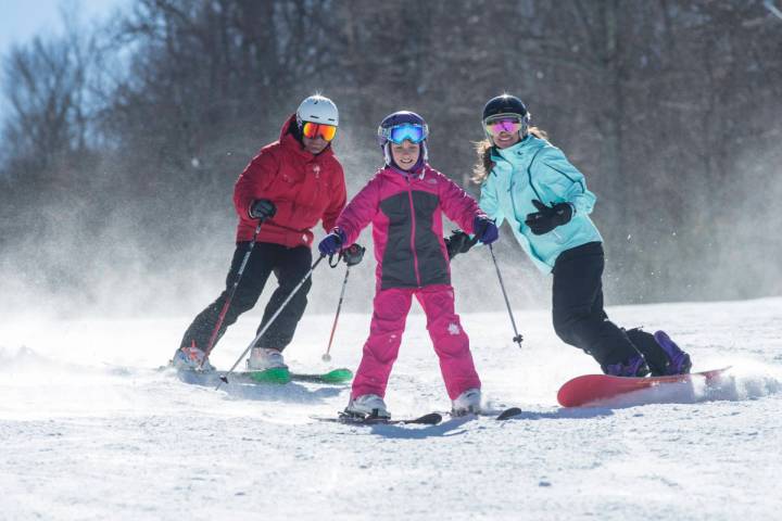 a person riding skis down a snow covered slope