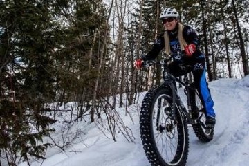 woman fat biking on snow